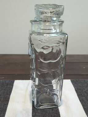 Clear Glass Apothecary Jar with Glass Stopper. Raised Embossed Apple Motif.